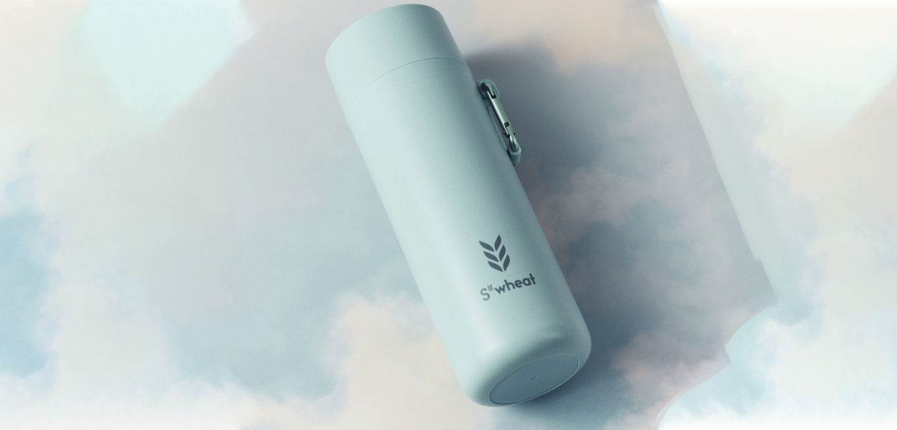 Blue reusable bottle against clouds background