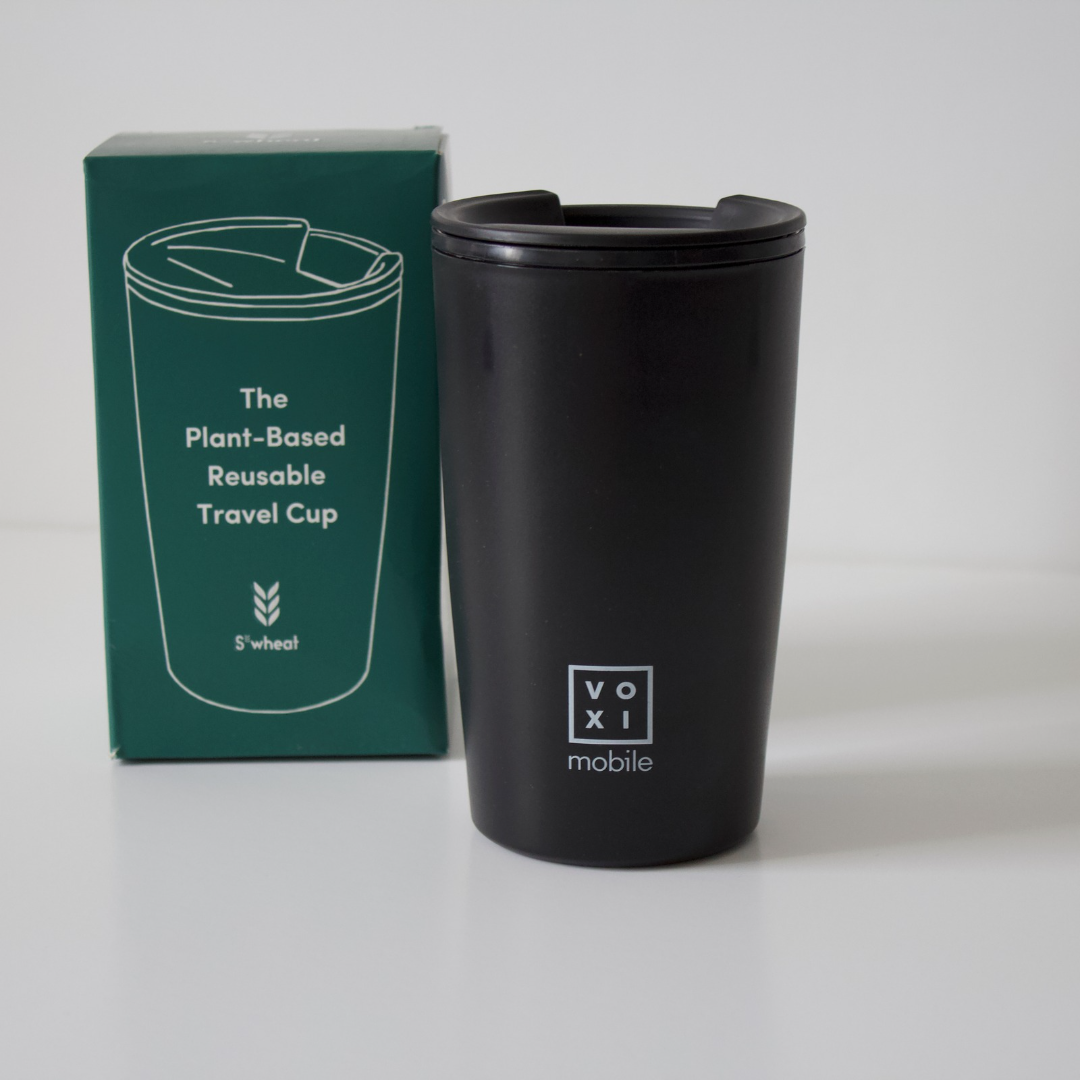 S'wheat travel cup with voxi logo beside green packaging displayed