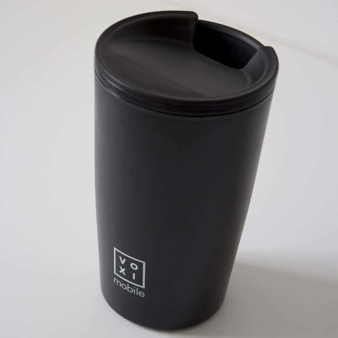 S'wheat travel cup with voxi mobile logo showing drinking lid